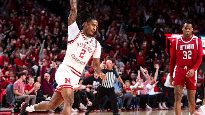 Nov 27, 2024; Lincoln, Nebraska, USA; Nebraska Cornhuskers guard Ahron Ulis celebrates after making a buzzer-beater shot from half court against the South Dakota Coyotes to end the first half.
