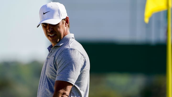 Apr 13, 2024; Augusta, Georgia, USA; Brooks Koepka walks on the No. 18 green during the third round