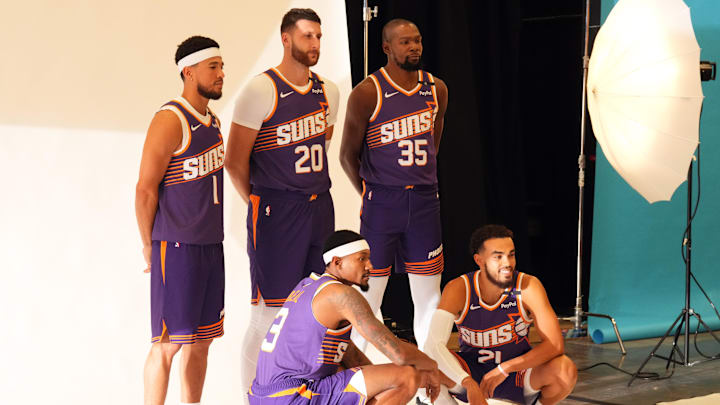 Sep 30, 2024; Phoenix, AZ, USA; Phoenix Suns guard Devin Booker (1) and Phoenix Suns center Jusuf Nurkic (20) and Phoenix Suns forward Kevin Durant (35) and Phoenix Suns guard Bradley Beal (3) and Phoenix Suns guard Tyus Jones (21) pose for a photo during Media Day at Footprint Center. Mandatory Credit: Joe Camporeale-Imagn Images