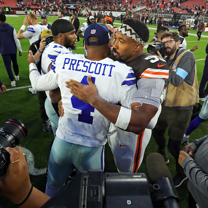 Cleveland Browns defensive end Myles Garrett hugs Dallas Cowboys quarterback Dak Prescott afer a game