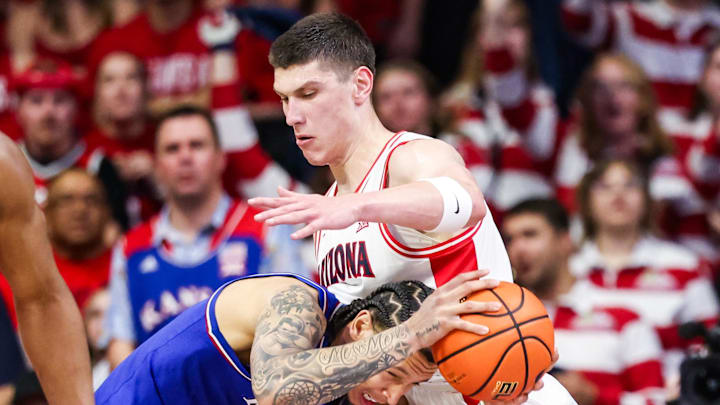 Feb 28, 2026; Tucson, Arizona, USA; Arizona Wildcats forward Ivan Kharchenkov (8) fouls Kansas Jayhawks guard Tre White (3) during the second half of the game at McKale Memorial Center. Mandatory Credit: Aryanna Frank-Imagn Images Feb 28, 2026; Tucson, Arizona, USA; Arizona Wildcats forward Ivan Kharchenkov (8) fouls Kansas Jayhawks guard Tre White (3) during the second half of the game at McKale Memorial Center. Mandatory Credit: Aryanna Frank-Imagn Images