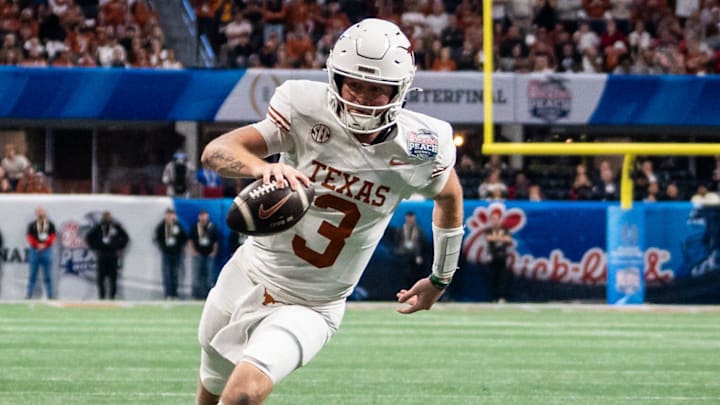 Texas Longhorns quarterback Quinn Ewers (3) runs the ball in to score a touchdown in the fourth quarter as the Texas Longhorns play the Arizona State Sun Devils in the Peach Bowl College Football Playoff quarterfinal at Mercedes-Benz Stadium in Atlanta, Georgia, Jan. 1, 2025.