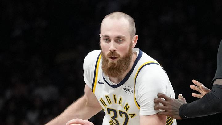 Apr 9, 2026; Brooklyn, New York, USA; Indiana Pacers center Jay Huff (32) dribbles the ball against Brooklyn Nets forward Trevon Scott (13) during the second half at Barclays Center. Mandatory Credit: Gregory Fisher-Imagn Images