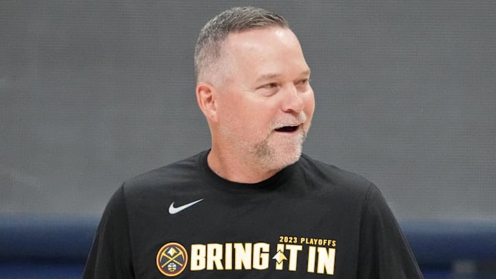 May 31, 2023; Denver, CO, USA; Denver Nuggets head coach Michael Malone smiles during a practice session on media day before the 2023 NBA Finals at Ball Arena. Mandatory Credit: Kyle Terada-Imagn Images
