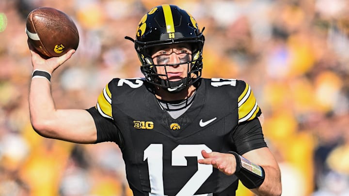 Oct 26, 2024; Iowa City, Iowa, USA; Iowa Hawkeyes quarterback Cade McNamara throws a pass against the Northwestern Wildcats during the first quarter at Kinnick Stadium. Mandatory Credit: Jeffrey Becker-Imagn Images