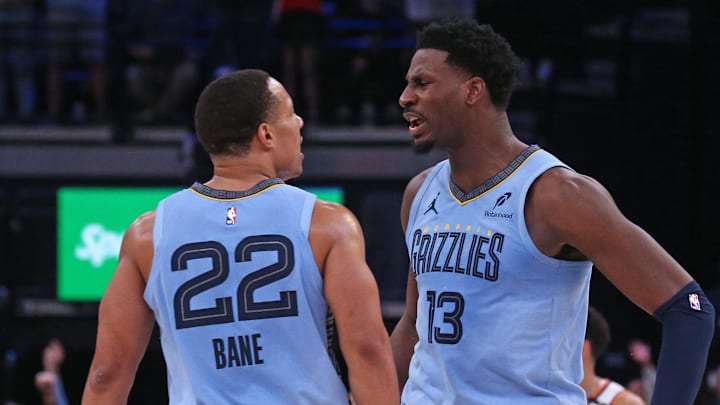 Feb 25, 2025; Memphis, Tennessee, USA; Memphis Grizzlies forward Jaren Jackson Jr. (13) reacts with Memphis Grizzlies guard Desmond Bane (22) during the third quarter against the Phoenix Suns at FedExForum. Mandatory Credit: Petre Thomas-Imagn Images Feb 25, 2025; Memphis, Tennessee, USA; Memphis Grizzlies forward Jaren Jackson Jr. (13) reacts with Memphis Grizzlies guard Desmond Bane (22) during the third quarter against the Phoenix Suns at FedExForum. Mandatory Credit: Petre Thomas-Imagn Images