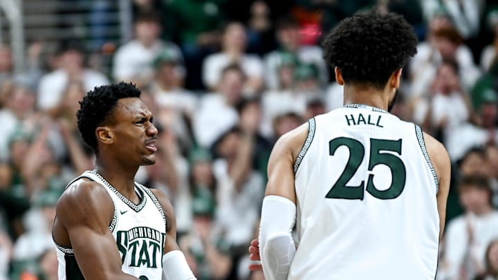 Michigan State's Tyson Walker, left, celebrates with Malik Hall after Hall's score against Maryland during the first half on Saturday, Feb. 3, 2024, at the Breslin Center in East Lansing.