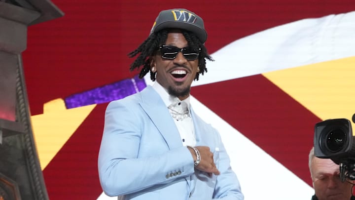 Apr 25, 2024; Detroit, MI, USA; LSU Tigers quarterback Jayden Daniels reacts after being selected by the Washington Commanders as the No. 2 pick in the first round of the 2024 NFL Draft at Campus Martius Park and Hart Plaza. Mandatory Credit: Kirby Lee-Imagn Images