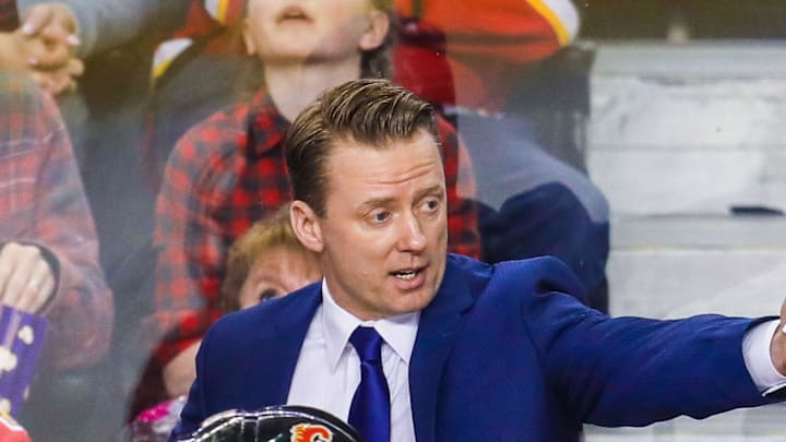 Apr 3, 2018; Calgary, Alberta, CAN; Calgary Flames head coach Glen Gulutzan on his bench during the first period against the Arizona Coyotes at Scotiabank Saddledome. Mandatory Credit: Sergei Belski-Imagn Images