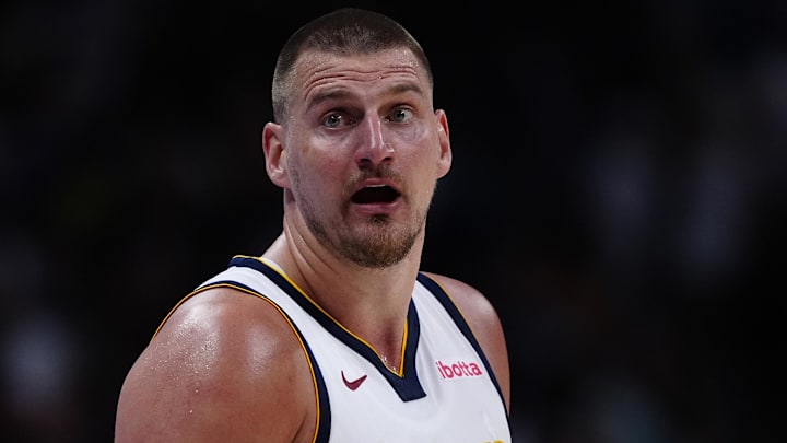 Apr 11, 2025; Denver, Colorado, USA; Denver Nuggets center Nikola Jokic (15) reacts in the fourth quarter against the Memphis Grizzlies at Ball Arena. Mandatory Credit: Ron Chenoy-Imagn Images