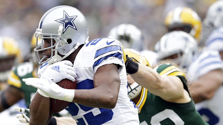 Jan 11, 2015; Green Bay, WI, USA; Dallas Cowboys running back DeMarco Murray (29) is tackled by Green Bay Packers outside linebacker Clay Matthews (52) in the first quarter in the 2014 NFC Divisional playoff football game at Lambeau Field. Mandatory Credit: Jeff Hanisch-Imagn Images