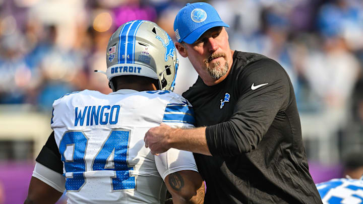 Oct 20, 2024; Minneapolis, Minnesota, USA; Detroit Lions head coach Dan Campbell greets defensive tackle Mekhi Wingo (94) before the game against the Minnesota Vikings at U.S. Bank Stadium. 