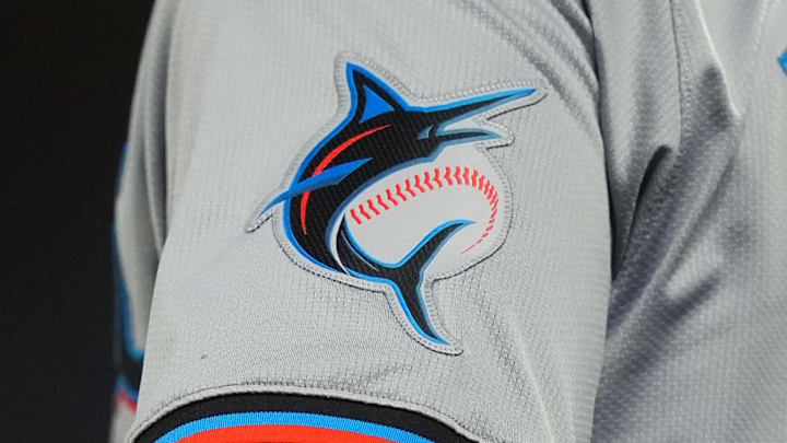 Detailed view of a Miami Marlins jersey emblem patch worn by Miami Marlins third base coach Griffin Benedict (81).