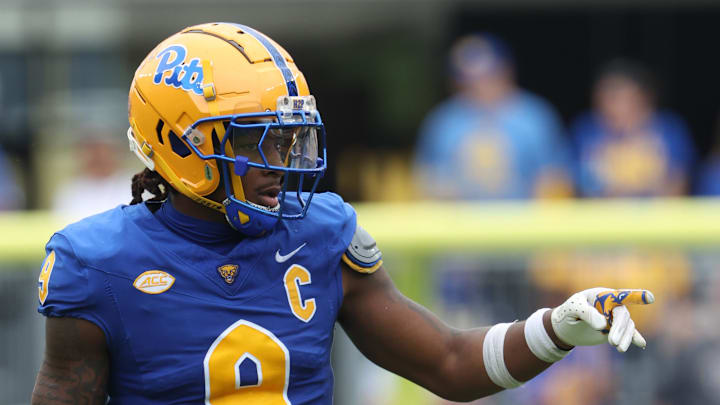 Sep 27, 2025; Pittsburgh, Pennsylvania, USA;  Pittsburgh Panthers linebacker Kyle Louis (9) gestures at the line of scrimmage against the Louisville Cardinals during the second quarter at Acrisure Stadium. Mandatory Credit: Charles LeClaire-Imagn Images