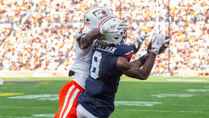 Auburn Tigers wide receiver Cam Coleman (8) catches a touchdown pass as Auburn Tigers take on Mercer Bears at Jordan-Hare Stadium in Auburn, Ala. on Saturday, Nov. 22, 2025. Auburn Tigers lead the Mercer Bears 35-17 at halftime.