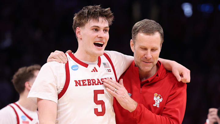Nebraska Cornhuskers forward Braden Frager and head coach Fred Hoiberg celebrate after defeating the Troy Trojans during a first-round game of the men's 2026 NCAA Tournament at Paycom Center.