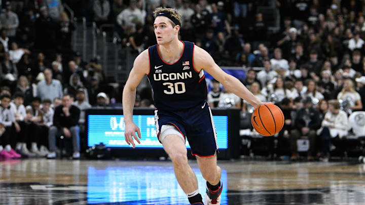 Mar 1, 2025; Providence, Rhode Island, USA; Connecticut Huskies forward Liam McNeeley (30) dribbles against the Providence Friars during the second half at Amica Mutual Pavilion. Mandatory Credit: Eric Canha-Imagn Images Mar 1, 2025; Providence, Rhode Island, USA; Connecticut Huskies forward Liam McNeeley (30) dribbles against the Providence Friars during the second half at Amica Mutual Pavilion. Mandatory Credit: Eric Canha-Imagn Images