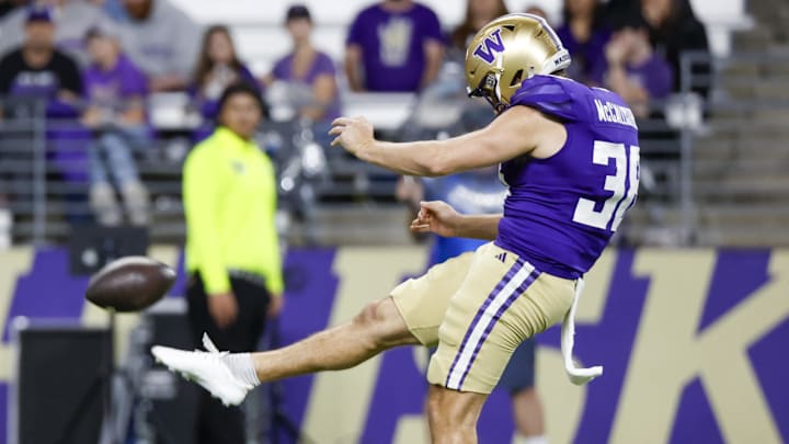 Aug 31, 2024; Seattle, Washington, USA; Washington Huskies punter Jack McCallister (38) punts against the Weber State Wildcats during the fourth quarter at Alaska Airlines Field at Husky Stadium.