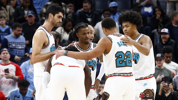 Dec 23, 2024; Memphis, Tennessee, USA; Memphis Grizzlies forward Santi Aldama (7), forward Jaren Jackson Jr. (13), guard Ja Morant (12), guard Desmond Bane (22) and forward Jaylen Wells (0) huddle during the fourth quarter against the Los Angeles Clippers at FedExForum. Mandatory Credit: Petre Thomas-Imagn Images Dec 23, 2024; Memphis, Tennessee, USA; Memphis Grizzlies forward Santi Aldama (7), forward Jaren Jackson Jr. (13), guard Ja Morant (12), guard Desmond Bane (22) and forward Jaylen Wells (0) huddle during the fourth quarter against the Los Angeles Clippers at FedExForum. Mandatory Credit: Petre Thomas-Imagn Images