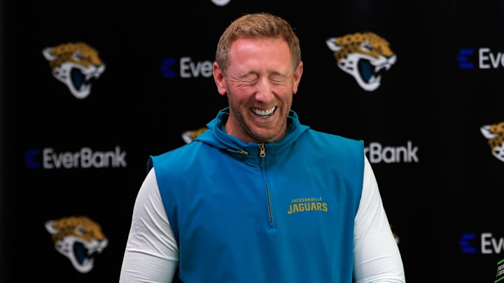Jacksonville Jaguars head coach Liam Coen laughs with media members after speaking at the lectern during a press conference at the Miller Electric Center, Monday, April 20, 2026 in Jacksonville, Fla.