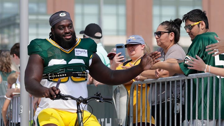 Green Bay Packers defensive lineman Nazir Stackhouse (93) high fives fans while participating in the Dream Drive bicycle ride. Green Bay Packers defensive lineman Nazir Stackhouse (93) high fives fans while participating in the Dream Drive bicycle ride.