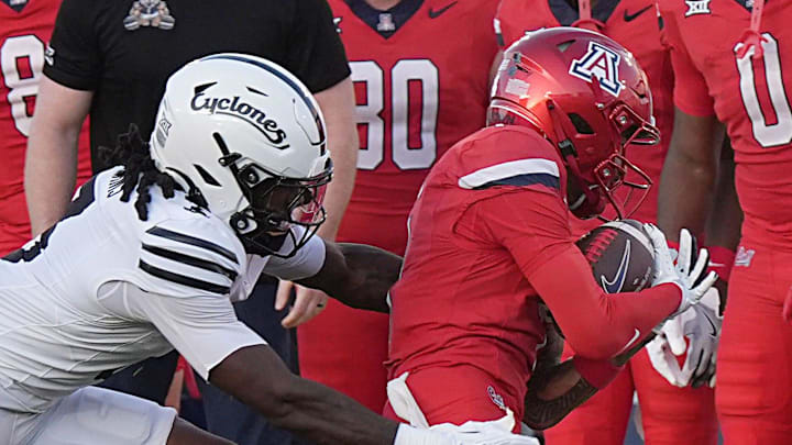 Arizona Wildcats wide receiver Kris Hutson (4) gets tackle by Iowa State Cyclones' defensive back Jontez Williams (3) after making a catch during the first quarter in the Big-12 conference showdown on Sept. 27, 2025, at Jack Trice Stadium in Ames, Iowa. Arizona Wildcats wide receiver Kris Hutson (4) gets tackle by Iowa State Cyclones' defensive back Jontez Williams (3) after making a catch during the first quarter in the Big-12 conference showdown on Sept. 27, 2025, at Jack Trice Stadium in Ames, Iowa.