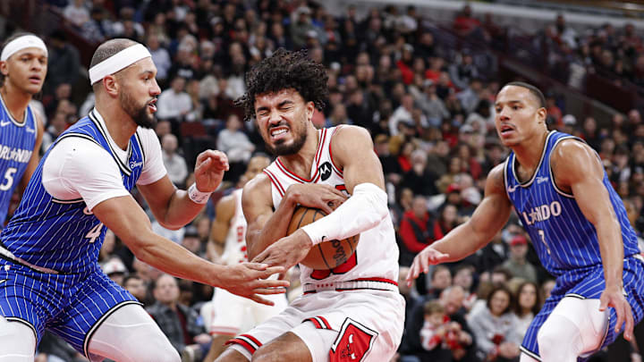 Jan 2, 2026; Chicago, Illinois, USA; Chicago Bulls guard Tre Jones (30) drives to the basket against Orlando Magic guard Jalen Suggs (4) during the first half at United Center. Mandatory Credit: Kamil Krzaczynski-Imagn Images
