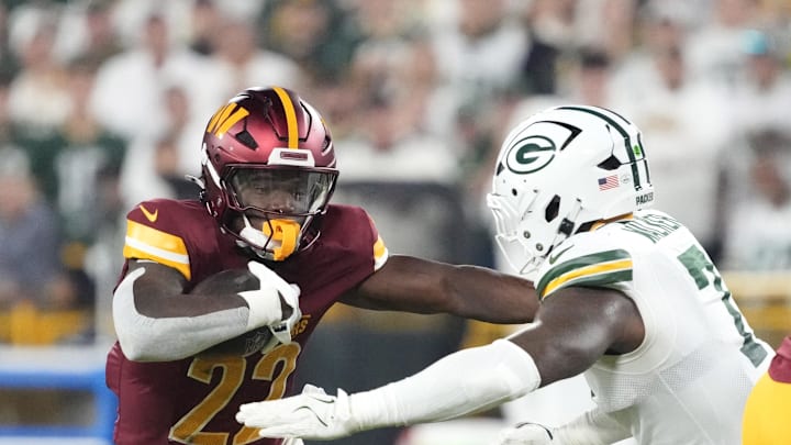Washington Commanders running back Jacory Croskey-Merritt runs against Green Bay Packers linebacker Quay Walker. Washington Commanders running back Jacory Croskey-Merritt runs against Green Bay Packers linebacker Quay Walker.
