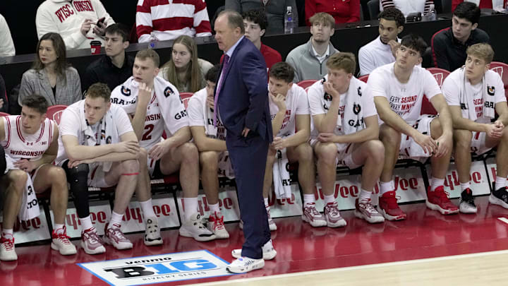 Wisconsin guard Isaac Gard, right, sits on the end of the bench as his father, head coach Greg Gard, watches his team during the first half of their game against Ohio State Saturday, January 31, 2026 at the Kohl Center in Madison, Wisconsin.