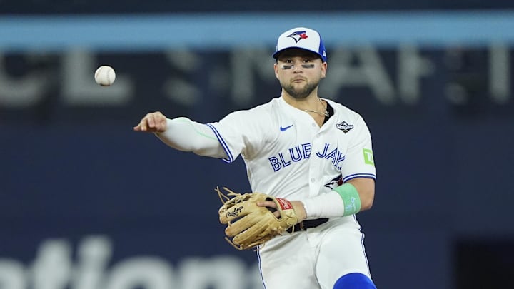 Toronto Blue Jays designated hitter Bo Bichette (11) throws to first on November 1, 2025