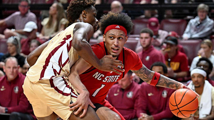Jan 10, 2026; Tallahassee, Florida, USA; North Carolina State Wolfpack forward Darrion Williams (1) drives to the net past Florida State Seminoles forward Thomas Bassong (3) during the first half at Donald L. Tucker Center. Mandatory Credit: Melina Myers-Imagn Images Jan 10, 2026; Tallahassee, Florida, USA; North Carolina State Wolfpack forward Darrion Williams (1) drives to the net past Florida State Seminoles forward Thomas Bassong (3) during the first half at Donald L. Tucker Center. Mandatory Credit: Melina Myers-Imagn Images
