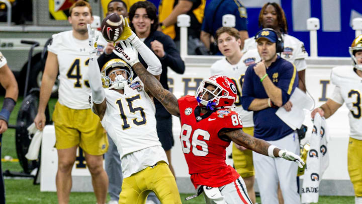 Jan 2, 2025; New Orleans, LA, USA;  Georgia Bulldogs wide receiver Dillon Bell (86) blocks a pass almost intercepted by Notre Dame Fighting Irish cornerback Leonard Moore (15) during the second half at Caesars Superdome. 