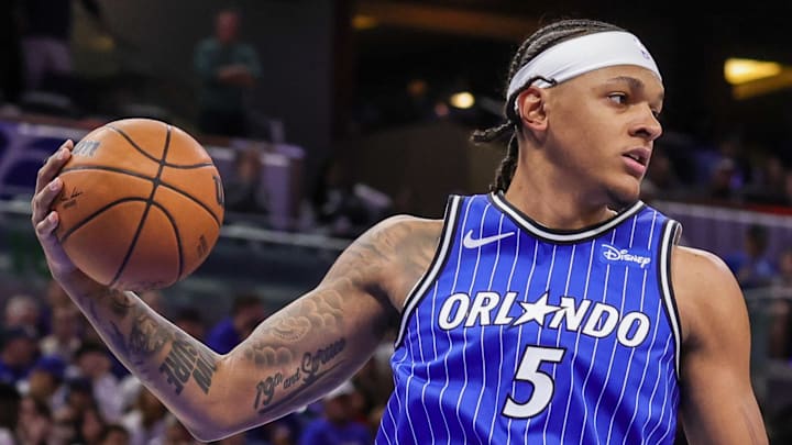 Mar 1, 2026; Orlando, Florida, USA; Orlando Magic forward Paolo Banchero (5) grabs the rebound during the first quarter against the Detroit Pistons at Kia Center. Mandatory Credit: Mike Watters-Imagn Images