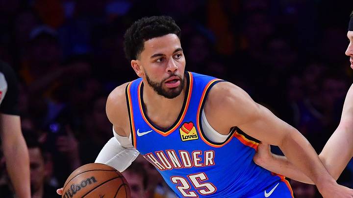 May 11, 2026; Los Angeles, California, USA; Oklahoma City Thunder guard Ajay Mitchell (25) moves the ball against Los Angeles Lakers guard Austin Reaves (15) during the first half in game four of the second round of the 2026 NBA Playoffs at Crypto.com Arena. Mandatory Credit: Gary A. Vasquez-Imagn Images