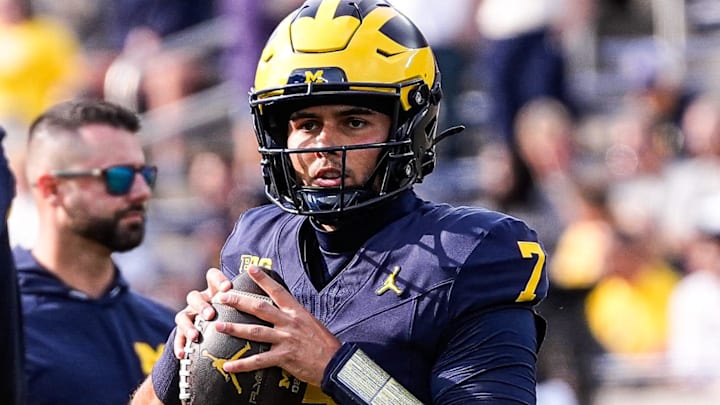 Michigan quarterback Mikey Keene (7) warms up ahead of the Washington game at Michigan Stadium in Ann Arbor on Saturday, Oct. 18, 2025. Michigan quarterback Mikey Keene (7) warms up ahead of the Washington game at Michigan Stadium in Ann Arbor on Saturday, Oct. 18, 2025.