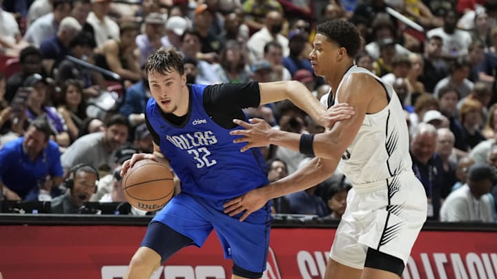 Dallas Mavericks forward Cooper Flagg drives past San Antonio Spurs forward Carter Bryant. Dallas Mavericks forward Cooper Flagg drives past San Antonio Spurs forward Carter Bryant.