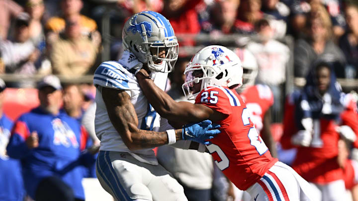 Oct 9, 2022; Foxborough, Massachusetts, USA; New England Patriots cornerback Marcus Jones (25) breaks up a pass intended for Detroit Lions wide receiver Josh Reynolds (8) during the first half at Gillette Stadium. Mandatory Credit: Brian Fluharty-Imagn Images