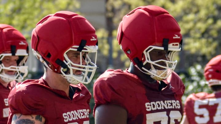Oklahoma offensive lineman Jake Maikkula and E'Marion Harris