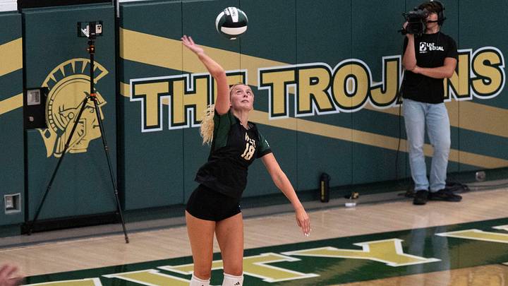 Iowa City West's Josephine Austen (18) serves to the Cedar Rapids Kennedy Cougars Aug. 25, 2026 during a volleyball match at Iowa City West High School in Iowa City, Iowa.