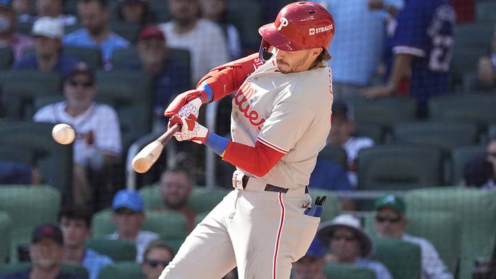 Sep 29, 2026; Cumberland, Georgia, USA;  Philadelphia Phillies second baseman Bryson Stott (5) hits a single during the seventh inning against the Atlanta Braves during game one of the Wildcard round for the 2026 MLB Playoffs at Truist Park.  Mandatory Credit: Dale Zanine-Imagn Images