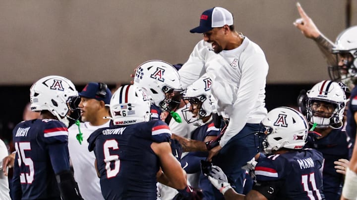 Oct 11, 2025; Tucson, Arizona, USA; Arizona Wildcats defensive back Dalton Johnson (43) celebrates an interception he caught from the Brigham Young Cougars with his team during the third quarter of the game at Arizona Stadium. Mandatory Credit: Aryanna Frank-Imagn Images Oct 11, 2025; Tucson, Arizona, USA; Arizona Wildcats defensive back Dalton Johnson (43) celebrates an interception he caught from the Brigham Young Cougars with his team during the third quarter of the game at Arizona Stadium. Mandatory Credit: Aryanna Frank-Imagn Images