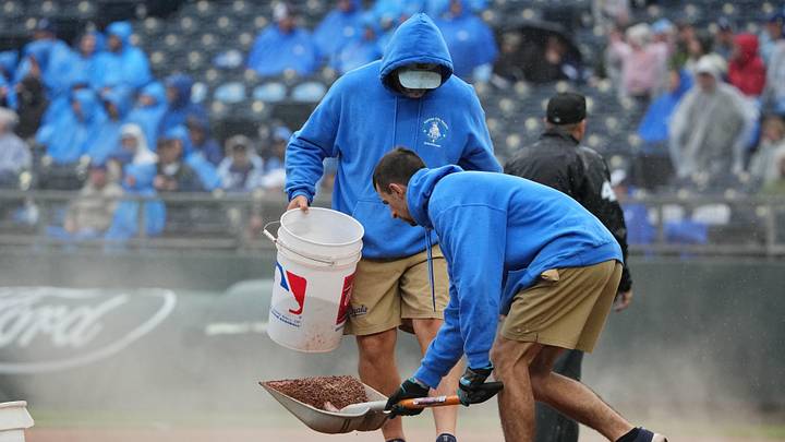 May 26, 2025; Kansas City, Missouri, USA; The Kansas City Royals grounds crew work on the mound during the rain in the fourth inning of the game against the Cincinnati Reds at Kauffman Stadium. Mandatory Credit: Denny Medley-Imagn Images May 26, 2025; Kansas City, Missouri, USA; The Kansas City Royals grounds crew work on the mound during the rain in the fourth inning of the game against the Cincinnati Reds at Kauffman Stadium. Mandatory Credit: Denny Medley-Imagn Images
