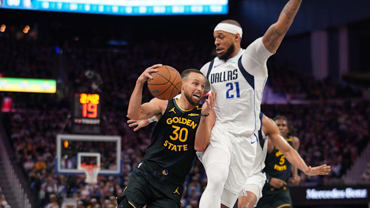 Nov 12, 2024; San Francisco, California, USA; Golden State Warriors guard Stephen Curry (30) is fouled by Dallas Mavericks forward Daniel Gafford (21) in the third quarter at the Chase Center. Mandatory Credit: Cary Edmondson-Imagn Images