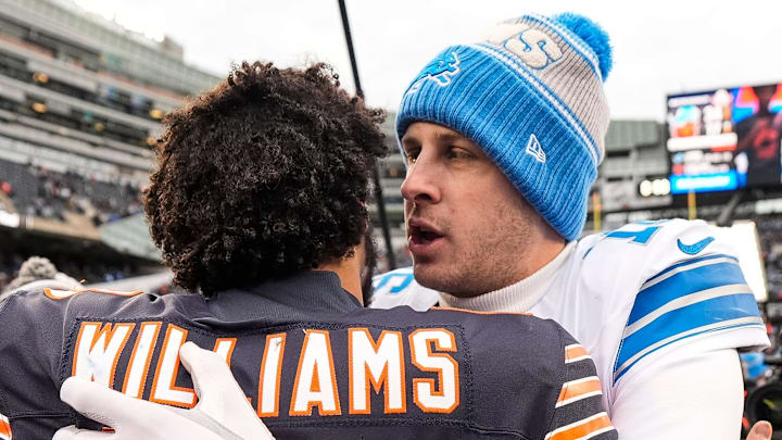 Detroit Lions quarterback Jared Goff (16) hugs Chicago Bears quarterback Caleb Williams (18).