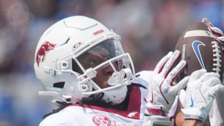 Memphis' Marcello Bussey has the ball pulled out of his hands by Arkansas' Julian Neal.