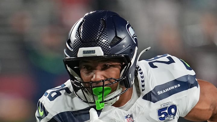 Seattle Seahawks running back Zach Charbonnet rushes the ball