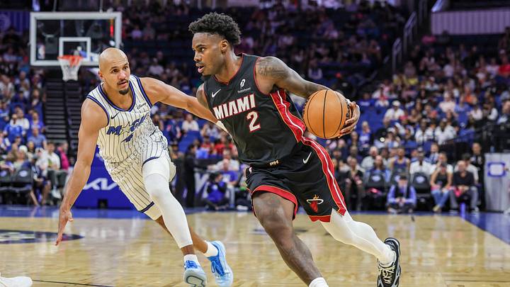 Oct 16, 2026; Orlando, Florida, USA; Miami Heat guard Davion Mitchell (2) drives past Orlando Magic guard Jalen Suggs (4) during the first quarter at Kia Center. Mandatory Credit: Mike Watters-Imagn Images Oct 16, 2026; Orlando, Florida, USA; Miami Heat guard Davion Mitchell (2) drives past Orlando Magic guard Jalen Suggs (4) during the first quarter at Kia Center. Mandatory Credit: Mike Watters-Imagn Images