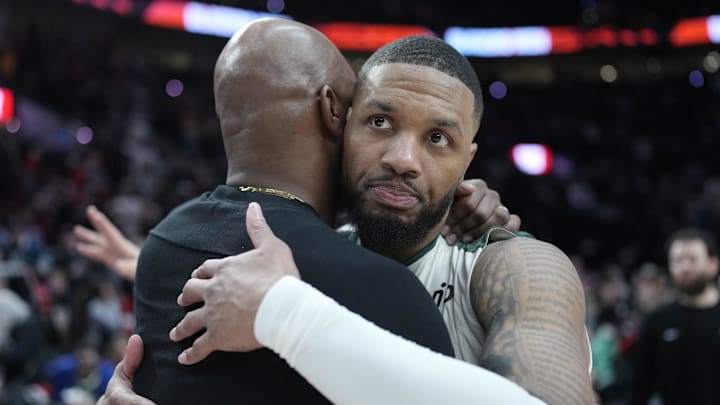 Jan 28, 2025; Portland, Oregon, USA; Portland Trail Blazers head coach Chauncey Billups embraces Milwaukee Bucks point guard Damian Lillard (0, right) after a game at Moda Center. Mandatory Credit: Soobum Im-Imagn Images
