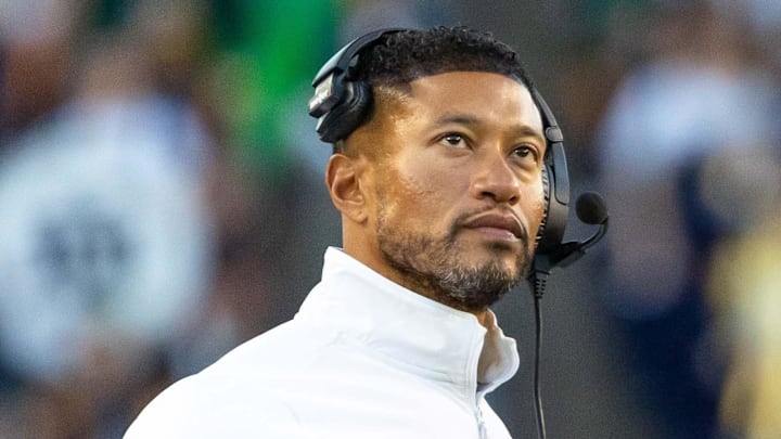 Oct 11, 2025; South Bend, Indiana, USA; Notre Dame Fighting Irish head coach Marcus Freeman talks with an official against the NC State Wolfpack during the second half at Notre Dame Stadium. 