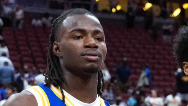 Mar 31, 2026; Glendale, AZ, USA; Caleb Holt (3) and Jason Crowe Jr (5) celebrate with the player of the game trophy following the McDonalds All American Boys Game at Desert Diamond Arena. Mandatory Credit: Mark J. Rebilas-Imagn Images